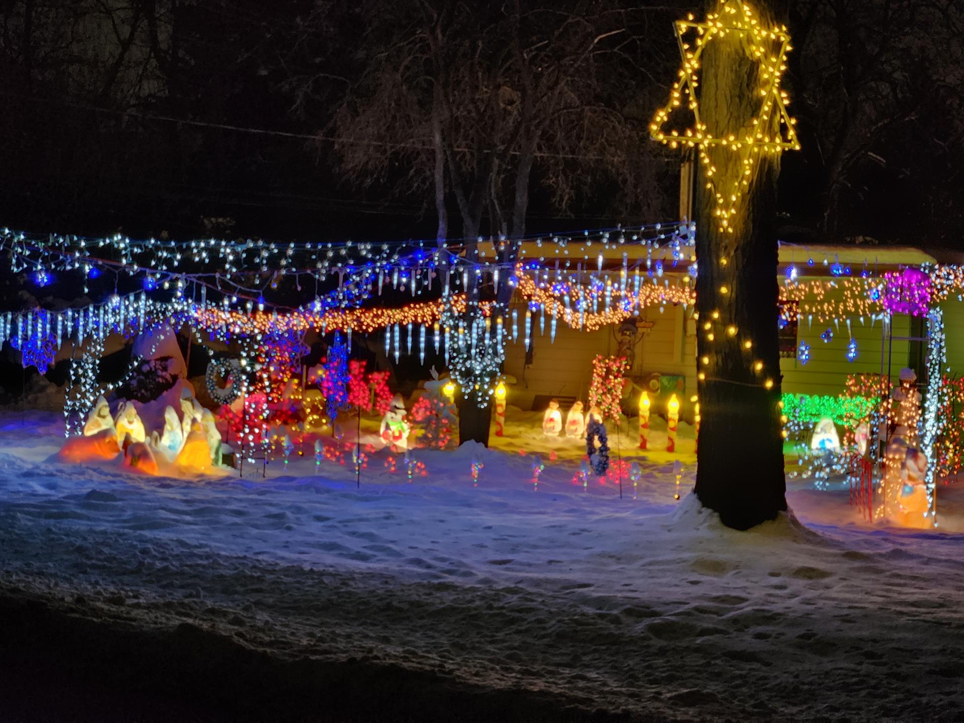 A house adorned with colorful Christmas lights